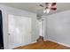 Well-lit bedroom featuring hardwood floors, a closet, and a ceiling fan at 790 N 14Th St, Noblesville, IN 46060