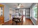 Elegant dining room with hardwood floors, stylish furniture, and modern ceiling fan at 790 N 14Th St, Noblesville, IN 46060