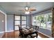 Traditional dining room features a ceiling fan, barn door, and natural light from large window at 790 N 14Th St, Noblesville, IN 46060