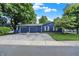 Detached two-car garage with navy blue siding and white trim offering ample parking and storage at 790 N 14Th St, Noblesville, IN 46060