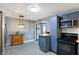 Updated kitchen features stainless steel appliances, stylish cabinetry, and modern lighting at 790 N 14Th St, Noblesville, IN 46060