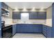 This kitchen features updated cabinets, stainless microwave, and modern backsplash at 790 N 14Th St, Noblesville, IN 46060