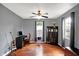Bright living room with hardwood floors, a ceiling fan, and natural light at 790 N 14Th St, Noblesville, IN 46060