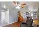 Inviting living room with hardwood floors, neutral paint, and an open layout into the dining area at 790 N 14Th St, Noblesville, IN 46060