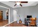 Bright living room with hardwood floors, a ceiling fan, and an open door at 790 N 14Th St, Noblesville, IN 46060