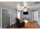 Cozy living room featuring a large window, ceiling fan, and a comfortable recliner at 790 N 14Th St, Noblesville, IN 46060