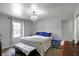 Cozy bedroom featuring a queen bed, stylish chandelier, and soothing gray walls at 790 N 14Th St, Noblesville, IN 46060