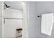 Clean walk-in shower with subway tile, built-in seat, and modern shower head at 790 N 14Th St, Noblesville, IN 46060