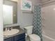 Small bathroom with a turtle themed shower curtain and a vanity at 8394 S Shady Trail Dr, Pendleton, IN 46064