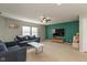Spacious living room featuring a large flat screen TV and lots of natural light at 8394 S Shady Trail Dr, Pendleton, IN 46064