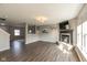 Spacious living room featuring hardwood floors, a cozy fireplace, and an open layout perfect for entertaining at 8394 S Shady Trail Dr, Pendleton, IN 46064