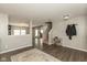 Open-concept living room with hardwood floors, leading to staircase, and offering ample space for entertaining guests at 8394 S Shady Trail Dr, Pendleton, IN 46064