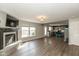 Open concept living room with hardwood floors, connecting to a modern kitchen and bright windows at 8394 S Shady Trail Dr, Pendleton, IN 46064