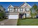 Charming two-story home with a well-maintained lawn, attached two-car garage, and beautiful brick and siding facade at 8416 Whitaker Valley Blvd, Indianapolis, IN 46237