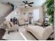 Cozy living room featuring neutral tones, plush seating, a decorative mirror, and ample natural light at 8416 Whitaker Valley Blvd, Indianapolis, IN 46237