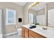Bright bathroom with double sink vanity and shower/bathtub combination at 8717 Vintner Ct, Indianapolis, IN 46256