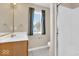 Bathroom with a large mirror, a sink, and a walk-in shower with glass doors at 8717 Vintner Ct, Indianapolis, IN 46256