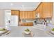Kitchen with white countertops, wooden cabinets and hardwood floors at 8717 Vintner Ct, Indianapolis, IN 46256