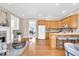 Open-concept space with hardwood floors, wood cabinetry, a fireplace, and access to other rooms at 8717 Vintner Ct, Indianapolis, IN 46256