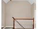 View of a staircase featuring wooden banisters and neutral-colored walls at 8717 Vintner Ct, Indianapolis, IN 46256
