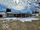 Backyard featuring a patio attached to the house with some snow and grass at 8738 Montery Ct, Indianapolis, IN 46226