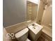 Compact bathroom with standard fixtures including toilet, sink with vanity, shower, and a mirrored medicine cabinet at 8738 Montery Ct, Indianapolis, IN 46226
