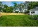 Expansive backyard featuring a lush green lawn and a wooden fence, perfect for outdoor activities at 8888 Cholla Rd, Indianapolis, IN 46240