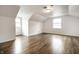 Large bedroom with hardwood floors, natural light from multiple windows, and neutral wall paint at 8888 Cholla Rd, Indianapolis, IN 46240