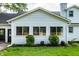 Charming white exterior features a new roof, manicured lawn, and well-maintained landscaping at 8888 Cholla Rd, Indianapolis, IN 46240