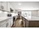 Stylish kitchen featuring stainless steel appliances, custom cabinets, and elegant backsplash, perfect for cooking at 8888 Cholla Rd, Indianapolis, IN 46240
