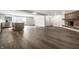 Modern living room and kitchen with stainless appliances and vinyl flooring at 8888 Cholla Rd, Indianapolis, IN 46240