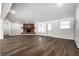 Spacious living room with brick fireplace, ample lighting, vinyl flooring and built-in cabinets at 8888 Cholla Rd, Indianapolis, IN 46240