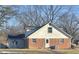 Back of home showing a brick foundation and white siding, plus a new exterior door and an air conditioning unit at 8888 Cholla Rd, Indianapolis, IN 46240