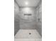Modern tiled shower with a built-in niche and contemporary shower head fixture at 8888 Cholla Rd, Indianapolis, IN 46240