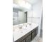 Bathroom featuring double sinks, a large mirror, and ample counter space at 953 Commander Ct, Westfield, IN 46074