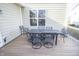 Backyard deck with a table with 6 chairs and wood flooring at 953 Commander Ct, Westfield, IN 46074