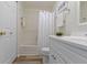 Bright bathroom with a shower-tub combination and modern vanity at 9788 Pine Ridge North Dr, Fishers, IN 46038