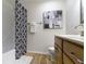 Nicely updated bathroom features modern decor, vanity, and shower-tub combo at 9788 Pine Ridge North Dr, Fishers, IN 46038