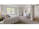 Cozy bedroom with large window, neutral carpet, and closet space at 9788 Pine Ridge North Dr, Fishers, IN 46038