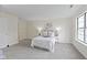 Bright, airy bedroom featuring neutral tones, carpet and a large window at 9788 Pine Ridge North Dr, Fishers, IN 46038
