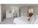 Spacious bedroom with plush carpet and views to an en-suite bathroom at 9788 Pine Ridge North Dr, Fishers, IN 46038