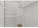 Walk-in closet featuring built-in shelving and ample storage space at 9788 Pine Ridge North Dr, Fishers, IN 46038