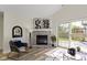 Bright living room showcasing a fireplace, vaulted ceilings, wood floors, and modern furnishings at 9788 Pine Ridge North Dr, Fishers, IN 46038
