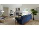 Inviting living room featuring a fireplace, wood floors, sliding glass doors and tasteful décor at 9788 Pine Ridge North Dr, Fishers, IN 46038