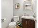Cozy half bathroom with a stylish vanity, modern fixtures, and a decorative mirror at 9956 Hickory Ridge Dr, Zionsville, IN 46077