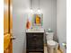 Comfortable half bathroom with a stylish vanity, modern fixtures, and a decorative mirror at 9956 Hickory Ridge Dr, Zionsville, IN 46077