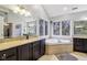 Bathroom featuring a large soaking tub, double vanity and ample counter space at 9956 Hickory Ridge Dr, Zionsville, IN 46077