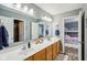 Bathroom featuring double vanity, and access to the shower area and the bedroom area at 9956 Hickory Ridge Dr, Zionsville, IN 46077