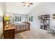 Bedroom with neutral walls, vaulted ceiling, and cozy furnishings at 9956 Hickory Ridge Dr, Zionsville, IN 46077