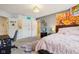 Bedroom includes a plush rug, comfortable bed, neutral colored walls, and a window for ample natural light at 9956 Hickory Ridge Dr, Zionsville, IN 46077
